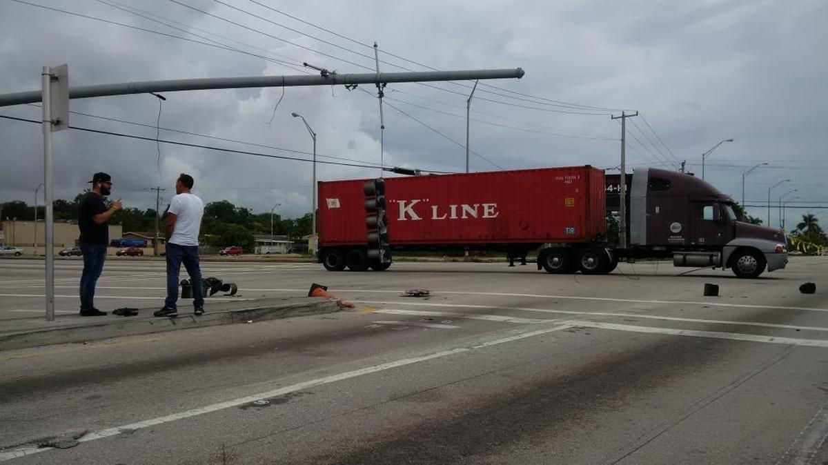 The intersection of Northwest 119th Street and 27th Avenue was shut down after two trucks got tangled in power lines Jan. 10, 2018.