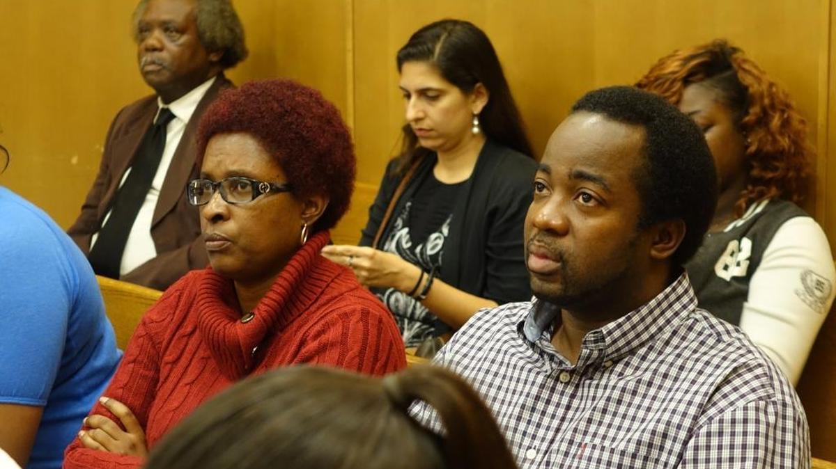 Blair Charles (left), the mother of 15-year-old murder suspect Deandre Charles, watches proceedings in Miami-Dade bond court. Her son is accused of fatally gunning down Rabbi Joseph Raksin as he walked to a synagogue in August 2014. The teen was denied bond. At right is his stepfather, Willis Archibald.