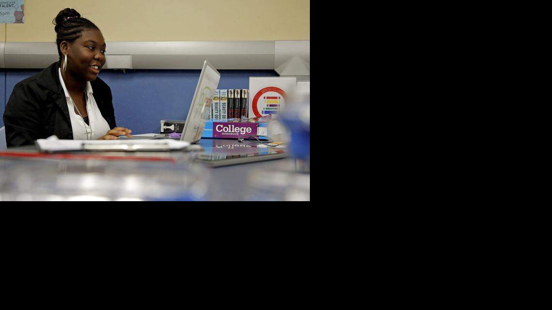 
Keturah Goulborne, 18, of Miami Gardens, works on a laptop that is provided to the students of the North Dade library branch's You Media program in Miami Gardens on Wednesday, October 8, 2014.
