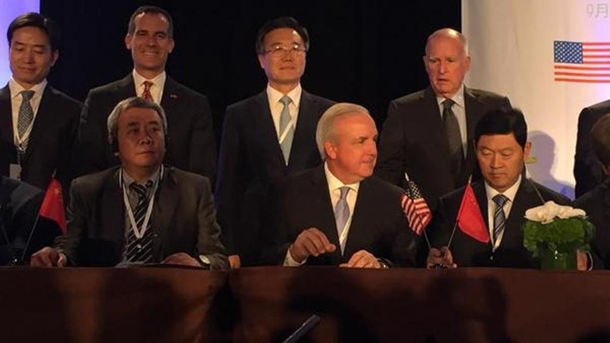 
Miami-Dade Mayor Carlos Gimenez joins U.S. and Chinese leaders in signing the “Climate Leaders Declaration” on Tuesday.
