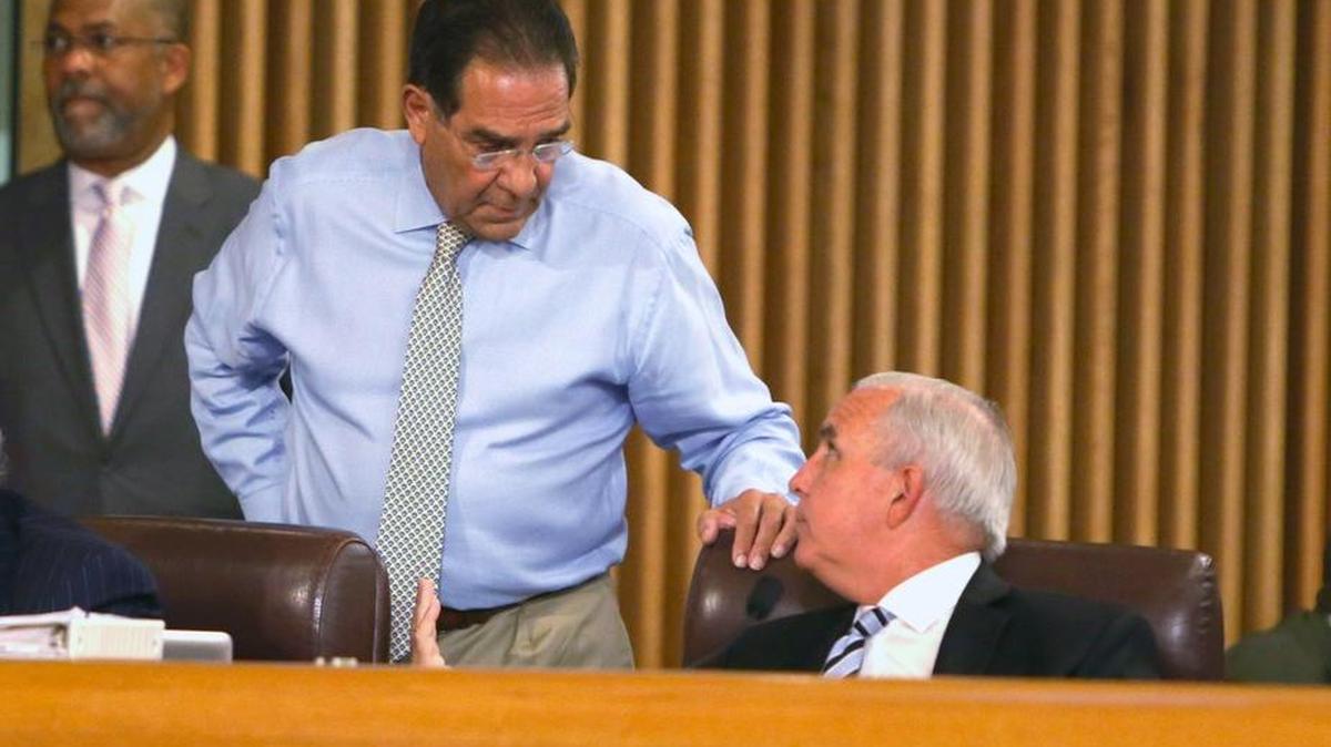
Miami-Dade County Mayor Carlos Gimenez, right, talks with Commissioner Xavier Suarez, left, at the Miami-Dade County Commission meeting on Tuesday June 30, 2015. On Wednesday, Suarez began airing TV commercials that criticize Mayor Gimenez’s proposed budget.
