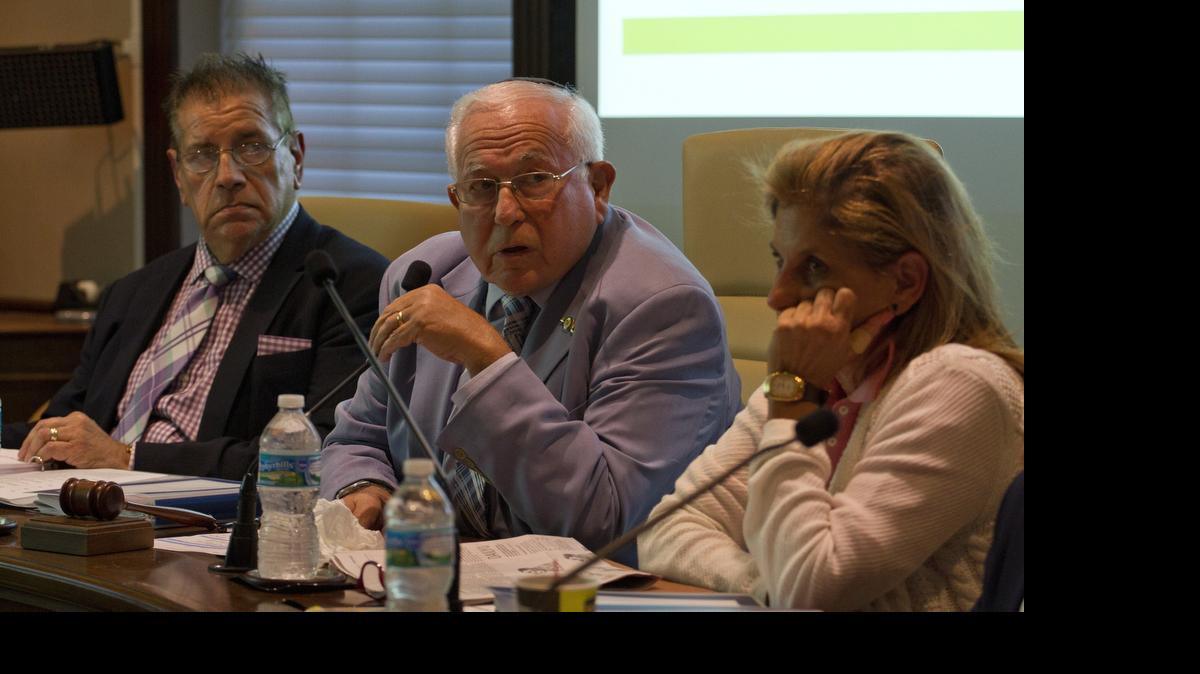 
Mayor Martin Packer (center) leads a discussion of the Miami Herald series License to Launder at the Bal Harbour village council meeting on Tuesday June 23, 2015, as Councilman Jaime Sanz and Assistant Mayor Patricia Cohen listen.
