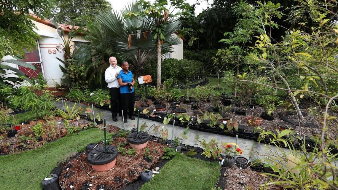 Tom Carroll and Hermine Ricketts stand in front of their home at 53 NE 106th St., Miami Shores, in November 2013, when the couple maintained a front-yard vegetable garden.