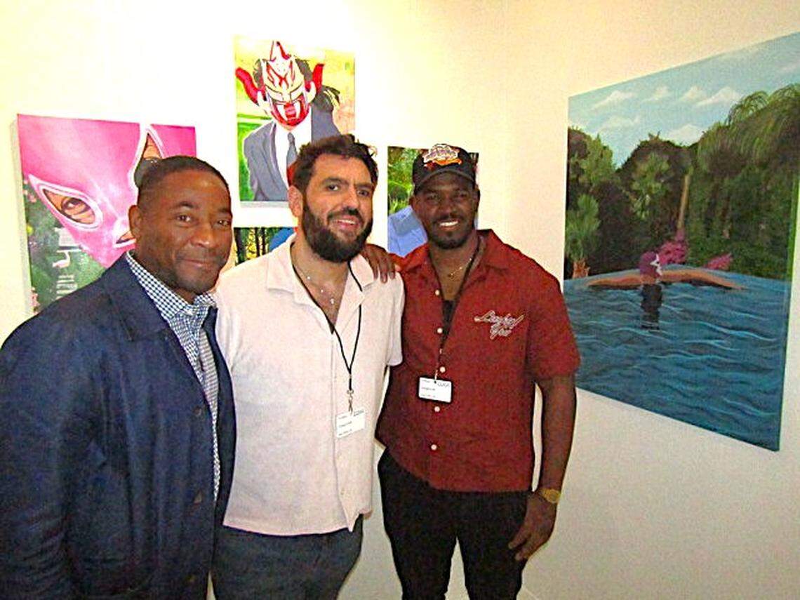 At the New Art Dealers Alliance in 2024 during Miami Art Week, Lee Moriarty, right,  poses with NADA board member Adam Abdalla, center, and Franklin Sirmans, an art critic, editor, writer, curator and director of the Pérez Art Museum Miami.