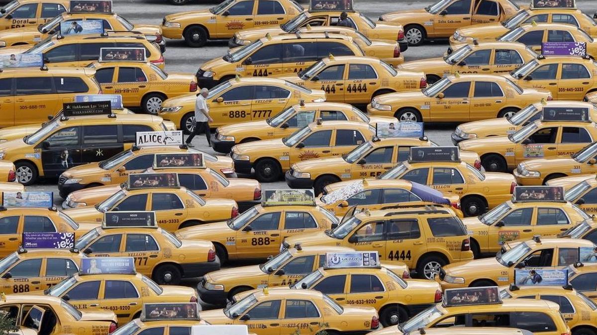 Taxis wait their turn in a holding area at Miami International Airport.