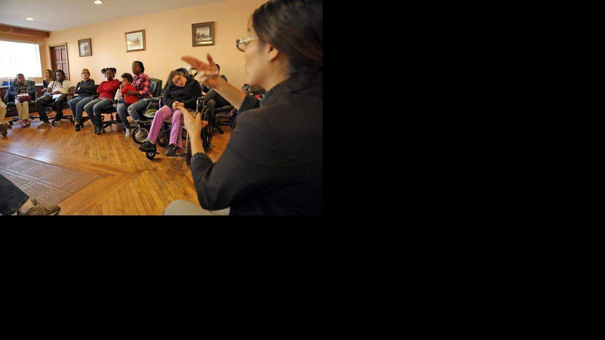 
Jacqueline Salcedo, a sign language interpreter, communicates with the hearing impaired at a meeting Friday between the Center for Independent Living of South Florida, people with disabilities, and the Agency for Health Care Administration (AHCA) discussing issues the disabled community has faced in the transition to Medicaid managed care.
