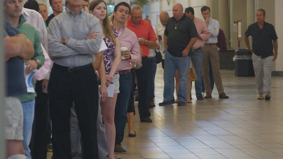 Voters line up at the Coral Ridge Mall,Tuesday, Nov. 8, 2016, at polling stations in Fort Lauderdale