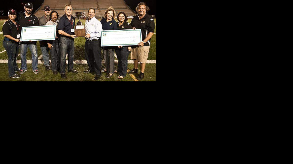 
Members of Westland Hialeah High School (left) and Mater Academy (right), joined by Miami-Dade County Commissioners Esteban Bovo Jr. and Jose ‘Pepe’ Diaz, received a $1,000 check for their respective athletic departments as part of the inaugural “Commissioners Cup.” Pictured are from left, Westland Hialeah’s assistant athletic directors Cynthia Rodriguez and Alex Gonzalez and assistant principals William Smith and Robin Boclair; Commissioners Bovo and Diaz; and Mater’s Principal Judith Marthy, Assistant Principal Tricia Castillo and Athletic Director/Coach Luis Sanchez.
