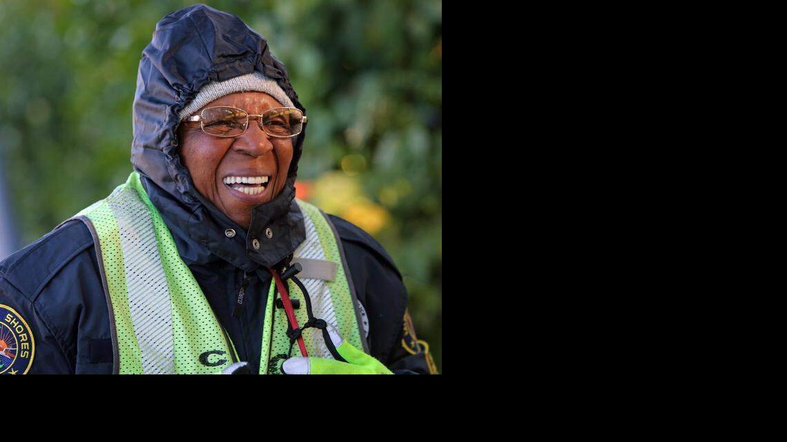 
COLD CROSSING: Miami Shores Elementary School crossing guard, Joan Zephyrine is bundled up early Thursday morning as she waits to help children cross Northeast 6th Avenue and Northeast 103rd Street on a chilly morning. Zephyrine, formerly of New York, says the weather is a nice change and feels for her family who still live in New York.
