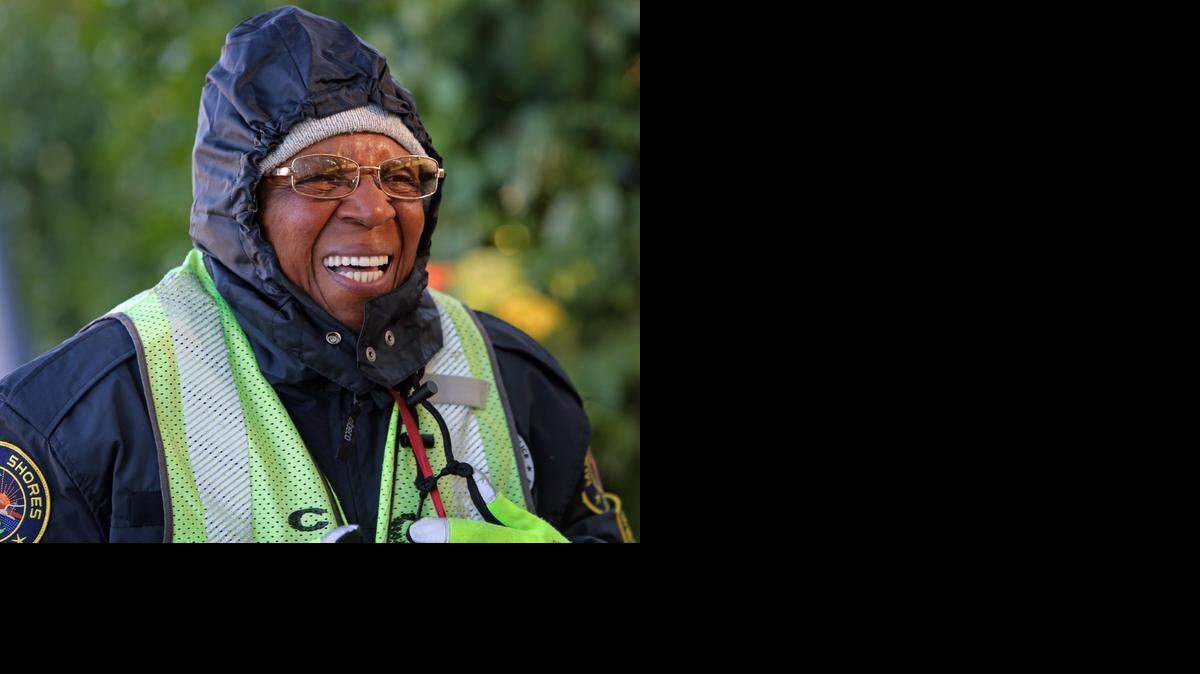 
COLD CROSSING: Miami Shores Elementary School crossing guard, Joan Zephyrine is bundled up early Thursday morning as she waits to help children cross Northeast 6th Avenue and Northeast 103rd Street on a chilly morning. Zephyrine, formerly of New York, says the weather is a nice change and feels for her family who still live in New York.
