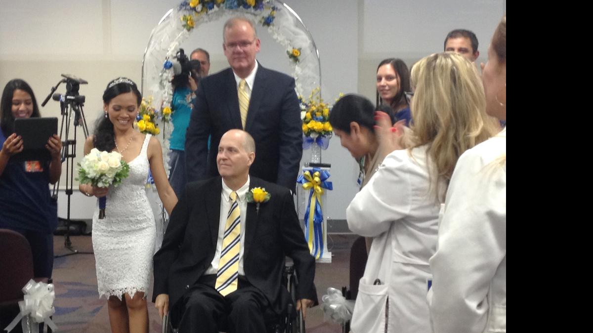 
James Brown and Eva Meiningsih were married at Jackon Memorial Hospital on Wednesday. Brown is a patient in the neuro-rehabilitation unit. 
