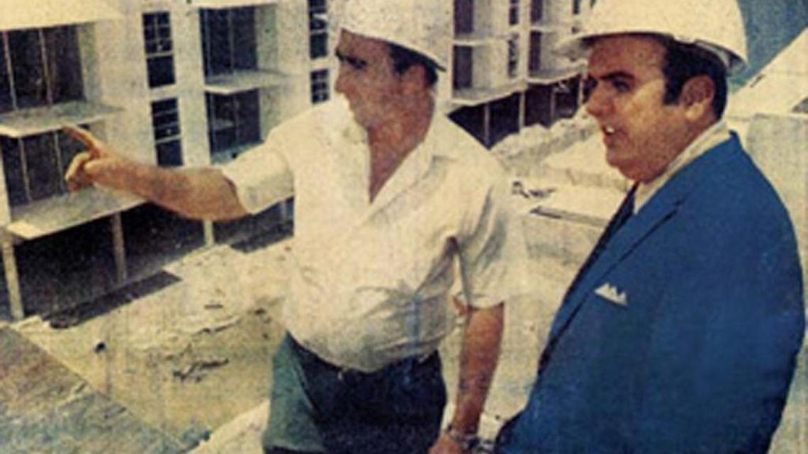 Jose Milton, right, looks over an apartment job with a superintendent in this undated file photo from the Miami Herald archives.