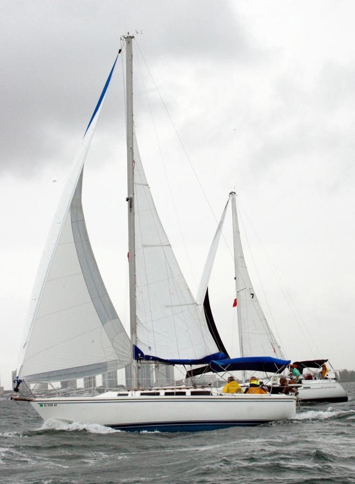 The boat in foreground overtakes a competitor in the Bacardi Columbus Day Regatta LVII, on Oct. 8, 2011 on Biscayne Bay. Organizers canceled the two-day regatta this week, citing damage to the waterfront and sailboats from Hurricane Irma.