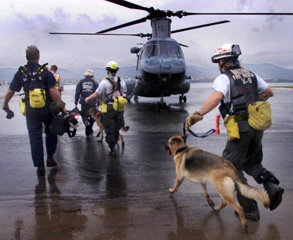A team from Miami-Dade’s Urban Search and Rescue Task Force run to board a U.S. Marine helicopter that will help get them to remote areas hit by a devastating earthquake in Turkey.