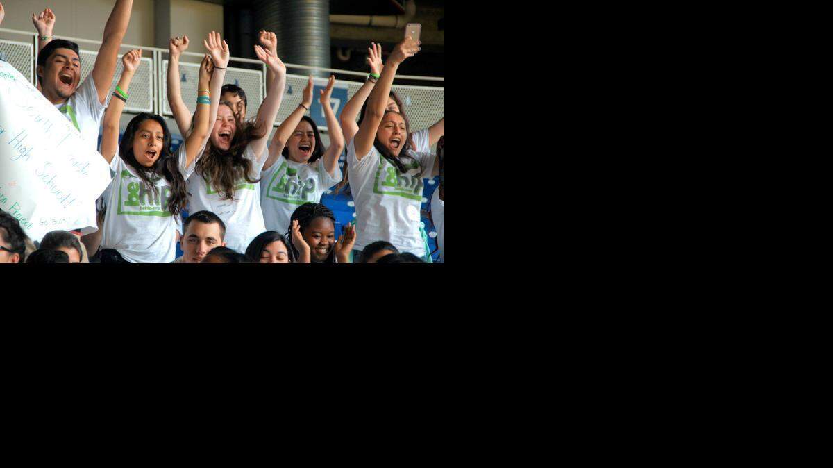 
Students from South Dade Senior High School cheer their school on at a Health Information Project event at Marlins Park on Tuesday. HIP Day honors the Health Information Project, a nonprofit organization that trains high school juniors and seniors to teach their fellow ninth graders about health issues. 
