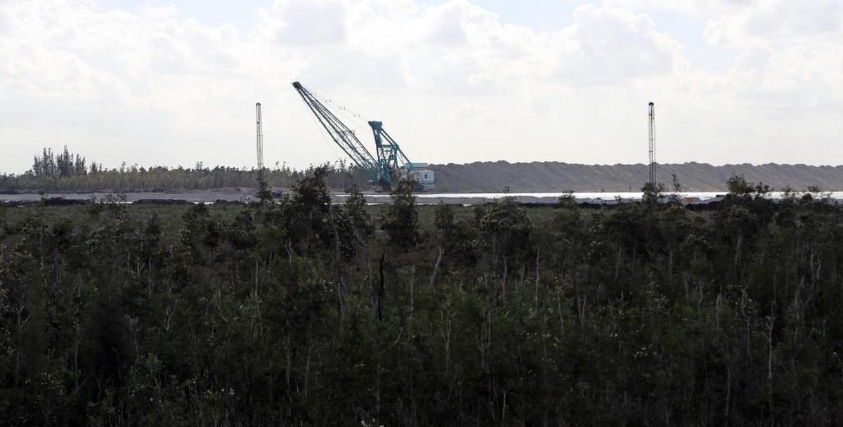 A large crane belonging to White Rock Quarries sits at the work site near the Dade/Broward line that has gradually become surrounded by residential development over the years. People who live in the blasting zone say it’s gotten worse as the mining moves closer to their houses.