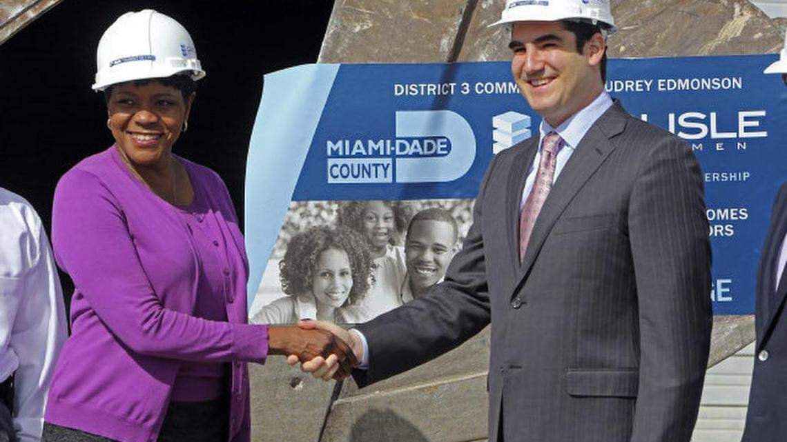 
County Commissioner Audrey Edmonson, shakes hands with Matthew Greer CEO Carlisle Development, at the wrecking ball ceremony for the Transit Village project in the 6300 block of NW Seventh Ave., Miami, on Oct., 24, 2012.
