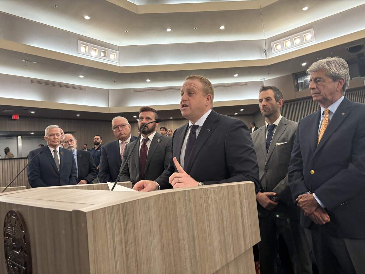 Jason Liberty, chairman and CEO of Royal Caribbean Group, speaks to Miami-Dade County commissioners on June 16, 2026, about the importance of the county securing a private fuel yard that services PortMiami. He’s flanked by local cruise executives, from left to right: Juan Kuryla, a former port director now working at Norwegian Cruise Line; Adam Ceserano, president of the Florida-Caribbean Cruise Association; Matthew Weintraub, port development director at Norwegian; and Richard Sasso, chairman of MSC Cruises USA.