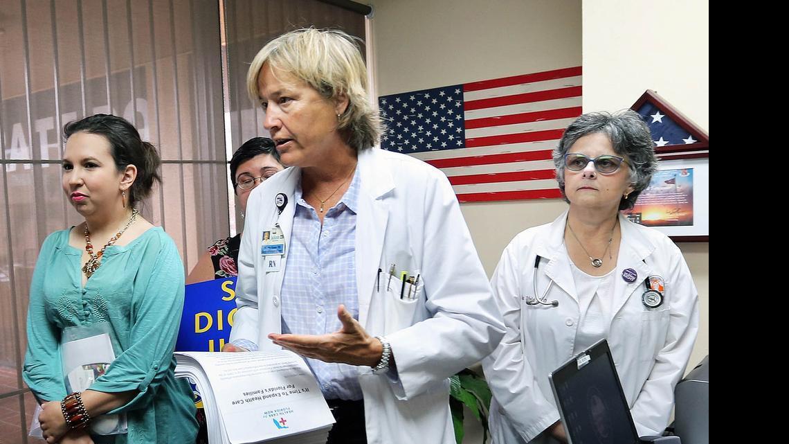 
Martha Baker (center), president of SEUI Local 1991, delivers 30,000 signatures in support of Medicaid expansion to the Hialeah office of state Rep. Jose Oliva. Hialeah ZIP code 33012, which is in his district, has the highest Affordable Care Act enrollment in the nation, yet Oliva opposes expansion — a provision of the ACA.
