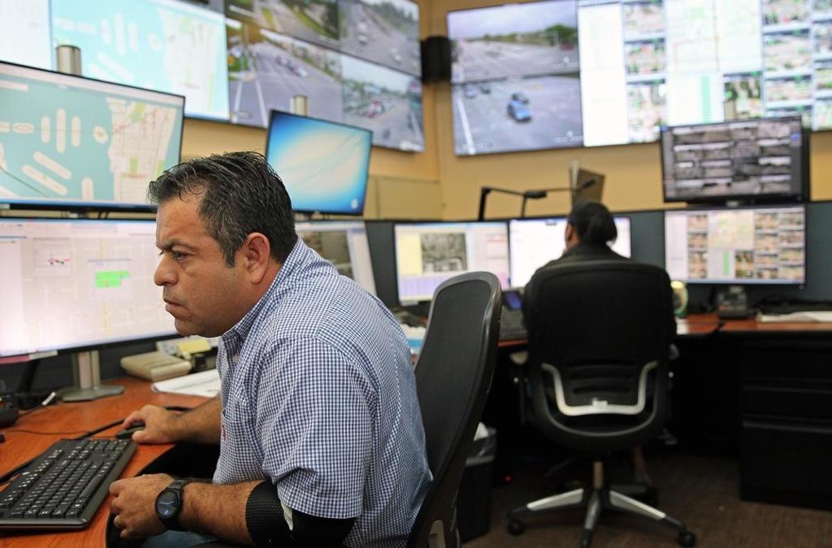 At Miami-Dade’s Traffic Management Center, Carlos R. Vasquez, traffic engineering manager, analyzes Monday morning traffic and adjusts traffic signals to speed commuters along.
