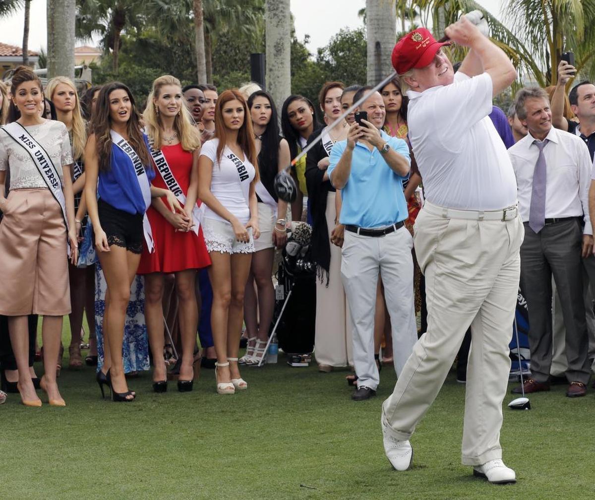 Donald Trump on the Red Tiger golf course. Miss Universe contestants watch on the newly renovated golf course at Trump International Doral Miami on January 12, 2015.