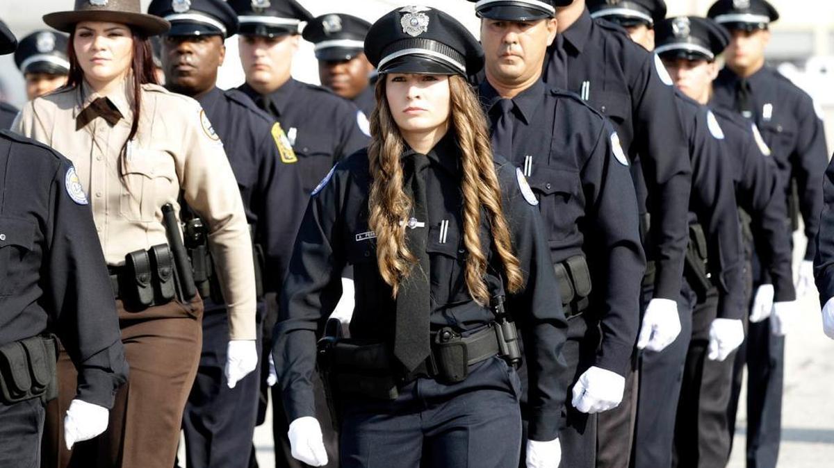 A line of graduates from Miami Dade College’s law-enforcement school march in this 2008 file photo.