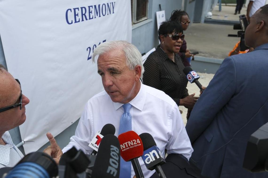 Miami-Dade County Mayor Carlos A. Gimenez speaks with the media after breaking ground for redevelopment of the Liberty Square Rising project.