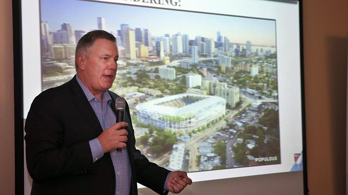 David Beckham partner Tim Leiweke addresses a town hall in Miami’s Overtown neighborhood on May 17, 2017. Behind him is a rendering of a Major League Soccer stadium being pursued by Beckham and partners. Leiweke recently voiced doubts the stadium deal would get done.