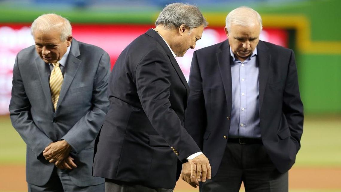 Miami Marlins' owner Jeffrey Loria, center, walks by Miami-Dade County Mayor Carlos Gimenez, far right, and City of Miami Mayor Tomas Regalado during the unveiling ceremony of the official logo of the 2017 All-Star game on Wednesday, July 27, 2016.