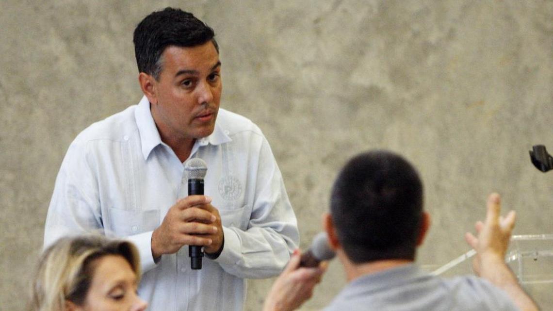 Former Miami Parking Authority Director of Development, Rolando Tapanes, listens to a resident’s complaint at a Q&A at Marlins Park Centerfield garage in 2012.