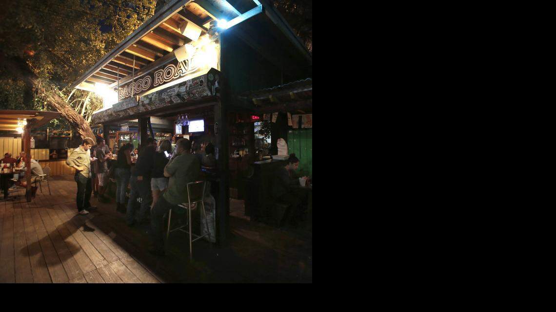 
Customers gather at the bar before the historic Tobacco Road closes its doors. Former New Times employees gathered at Tobacco Road for small reunion to catch up and reminisce about the old days when their office was on the second floor near the bar.
