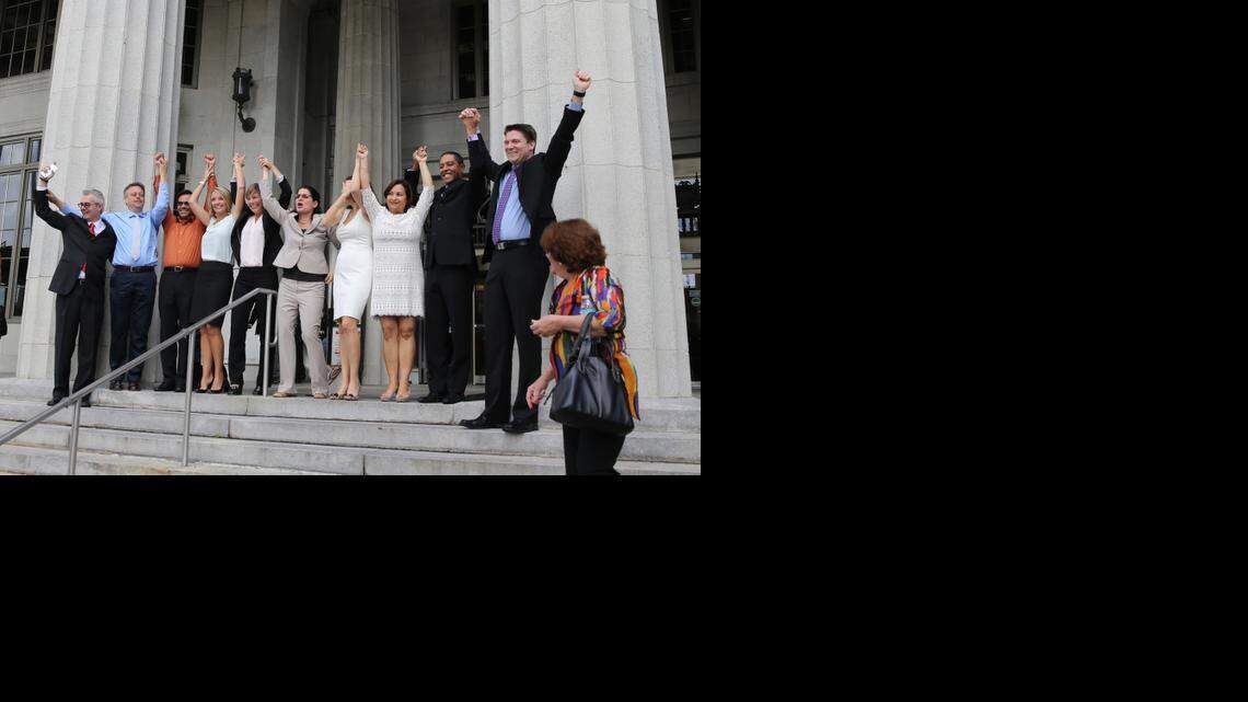 
Same-sex couples and their attorneys in Miami celebrate Circuit Court Judge Sarah Zabel’s decision to lift the legal stay she had placed on her July decision declaring Florida’s gay-marriage ban unconstitutional.
