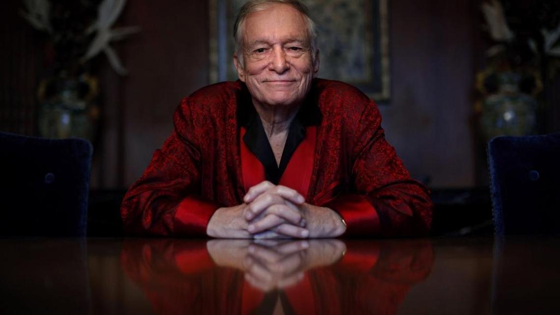 In this Nov. 4, 2010, file photo, Playboy magazine founder Hugh Hefner poses for photos at the Playboy Mansion in Los Angeles.