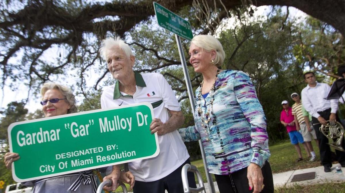 
Jacqueline Mulloy and Diane Mulloy stand Gardnar Mulloy of Miami as he is honored with a street sign in 2013.
