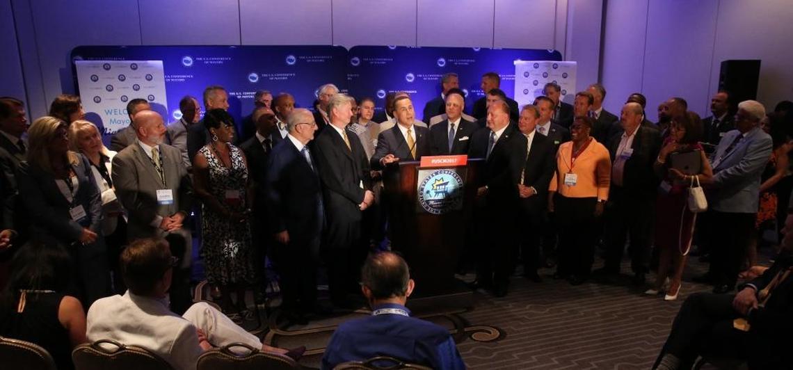 The 85th annual meeting of The United States Conference of Mayors, taking place at the Fontainbleau kicked off with a press conference on Friday. Miami Beach Mayor Philip Levine speaks, surrounded by mayors from across the country.