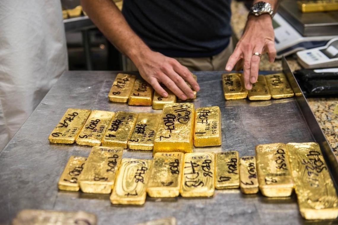 Gold bullion is invoiced prior to testing for purity at a trading house in downtown Miami’s jewelry and diamond district on Dec. 12, 2014.