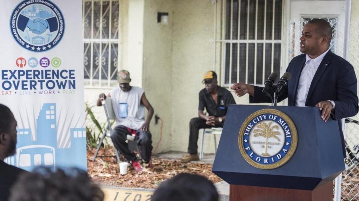 Miami City Commissioner Keon Hardemon talks to residents as the Overtown redevelopment agency holds a groundbreaking ceremony for a rehabilitation of Town Park South.