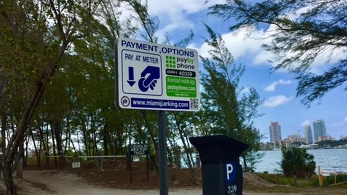 A new parking sign and pay machine next to the mountain-bike trail system on Virginia Key