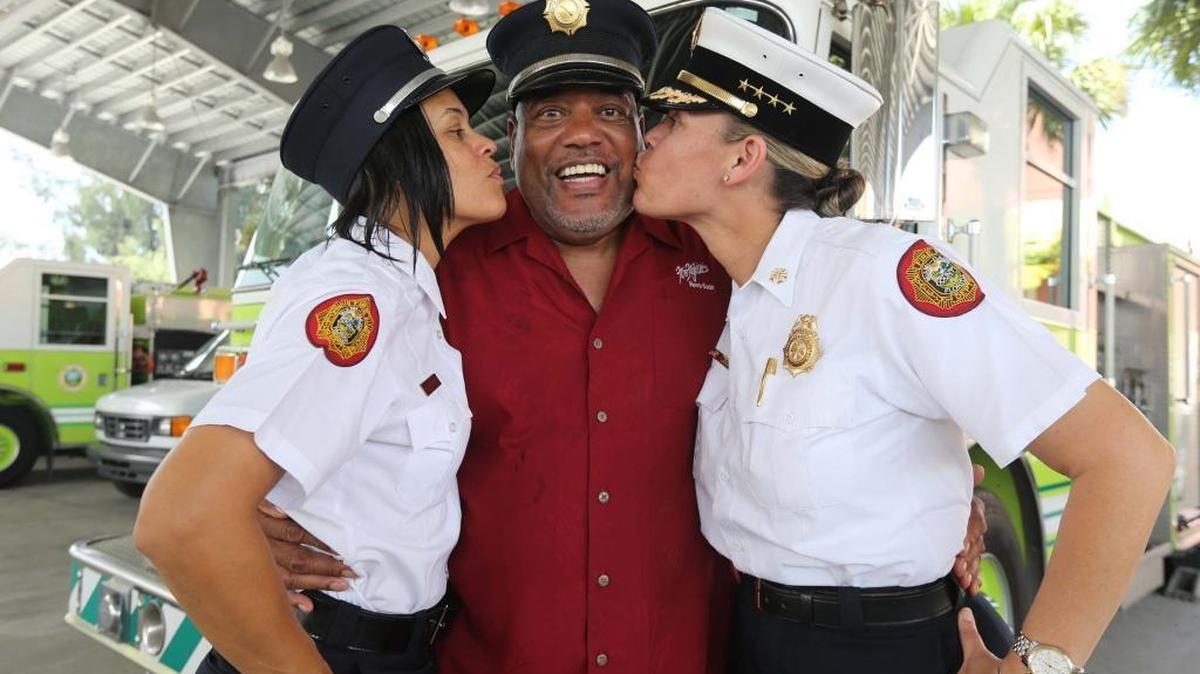 Retired Miami-Dade Fire Lt. Tommie Williams with his daughters firefighter Kellie Wiggins and Division Chief Robin Duren at Miami-Dade Fire Rescue headquarters, June 15, 2016.