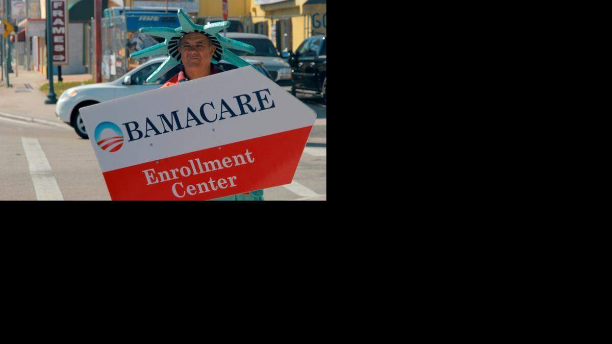 
A man dressed as the Statue of Liberty advertises for an Affordable Care Act enrollment center on a Little Havana sidewalk on Feb. 13. As open enrollment came to a close in 2015, navigators across Miami-Dade made one final push to sign Floridians up for healthcare coverage under the Affordable Care Act. A special enrollment period is now open from Feb. 16 to Feb. 22 for those who experienced issues with the system. 
