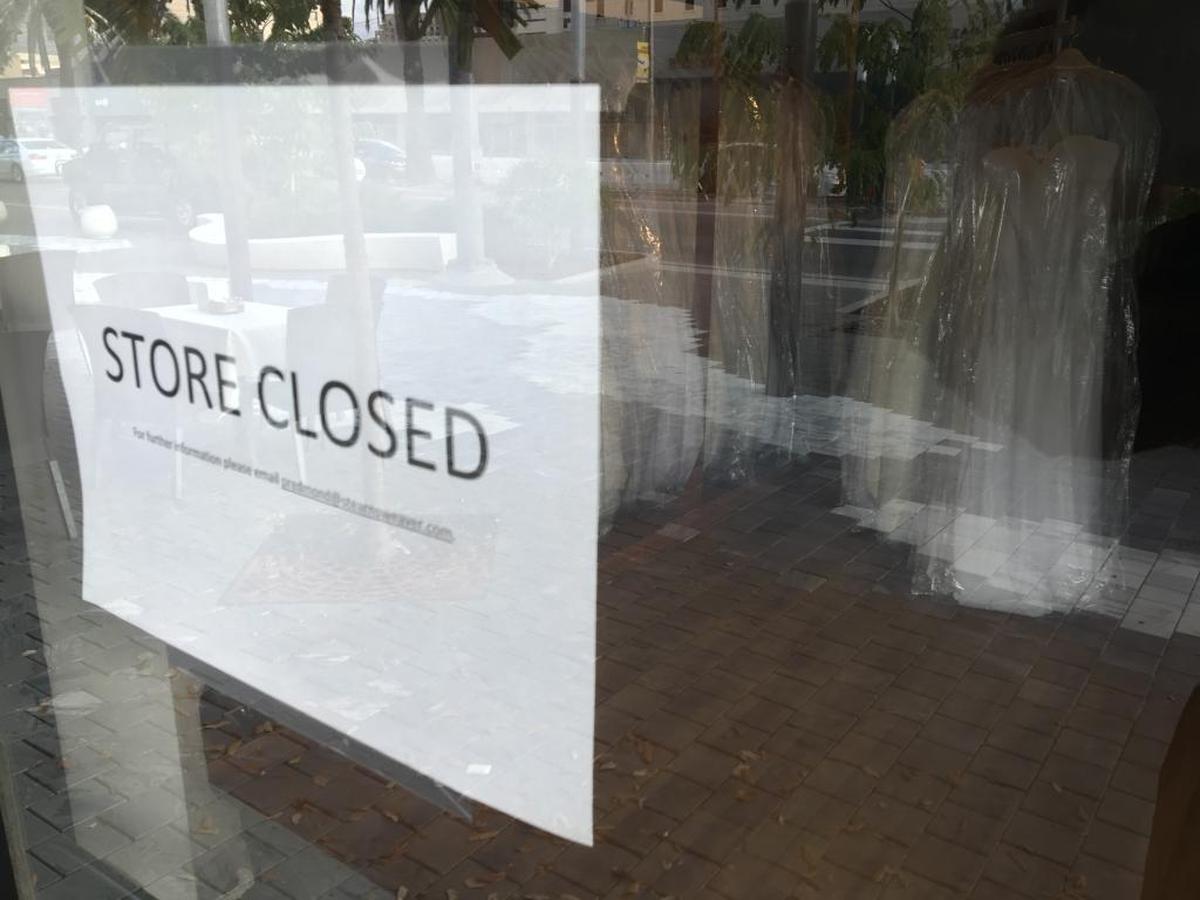 The sign greeting visitors to the Alfred Angelo bridal shop on Coral Gables. In small type, the sign says to email Miami bankruptcy lawyer Patricia Redmond for more information. Many brides have.