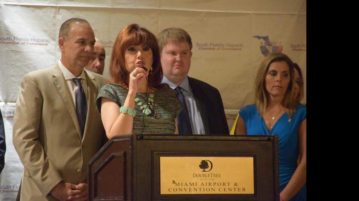 
Liliam Lopez, President and CEO of the South Florida Hispanic Chamber of Commerce, speaks at the Latino Health and Wellness Expo in Miami Friday to urge the Florida House of Representatives to pass a Senate proposal that would expand Medicaid and cover 850,000 uninsured Floridians. 

