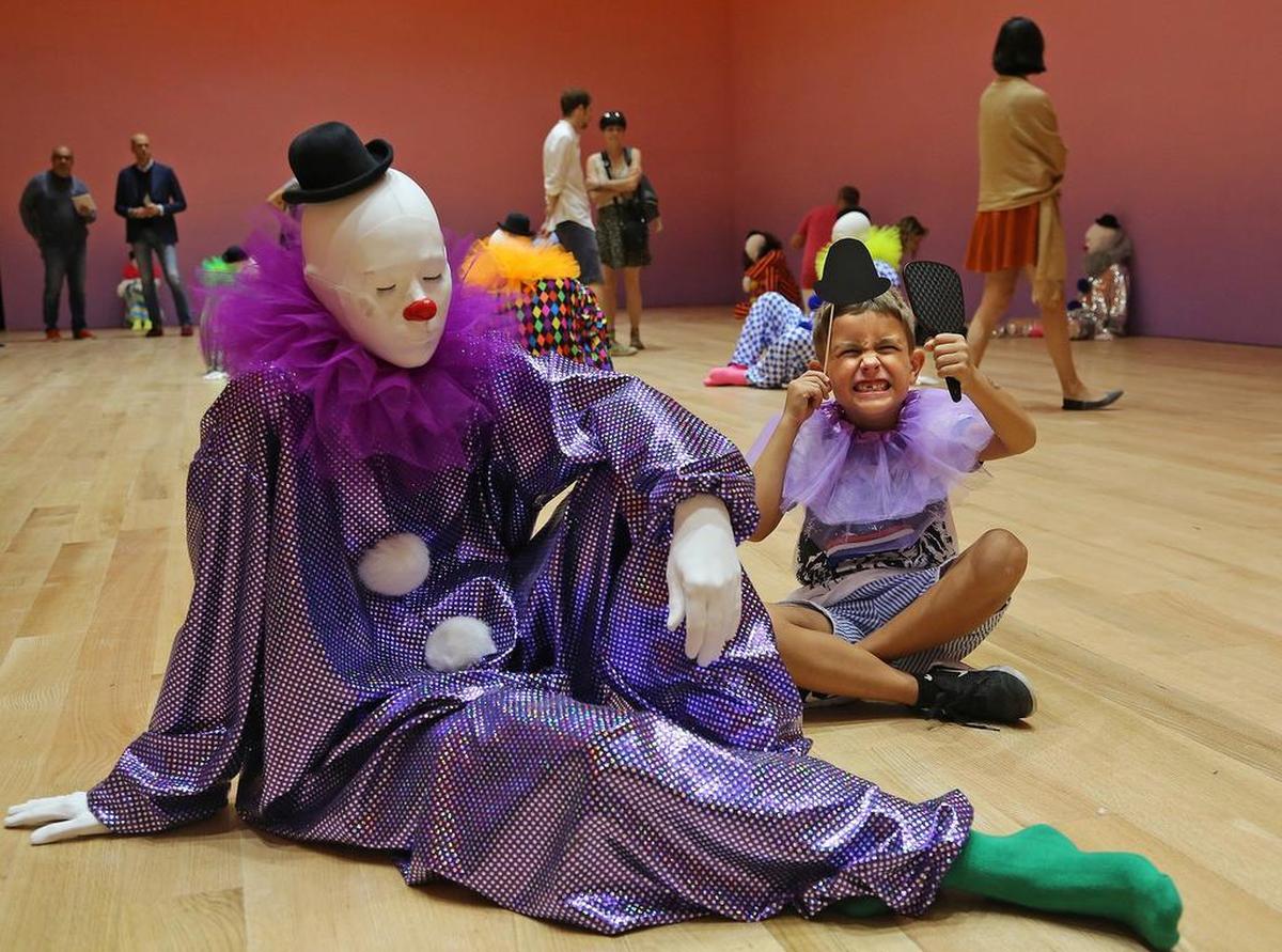 Mark Samoylov, 6, plays the part of the clown at Ugo Rondinone’s “Vocabulary of Solitude” exhibit during the reopening of the renovated Bass museum in October.
