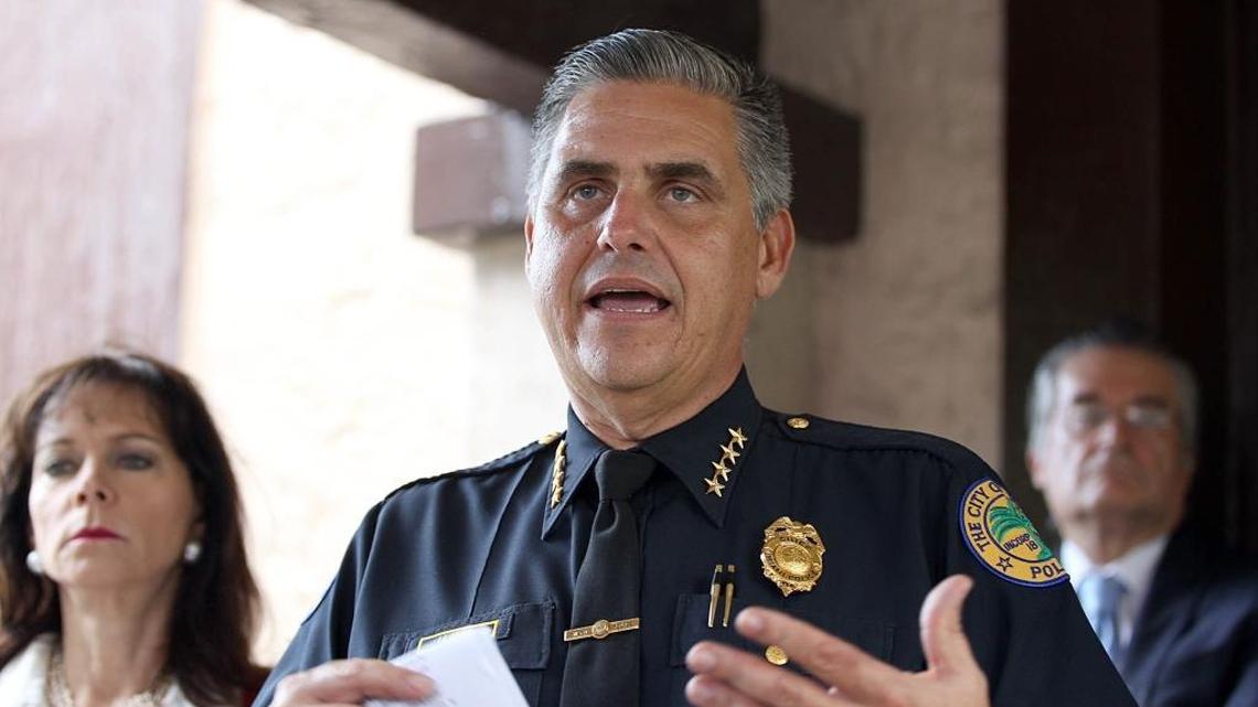 City of Miami Police Chief Rudy Llanes is flanked by State Attorney Katherine Fernández Rundle during a news conference last year.