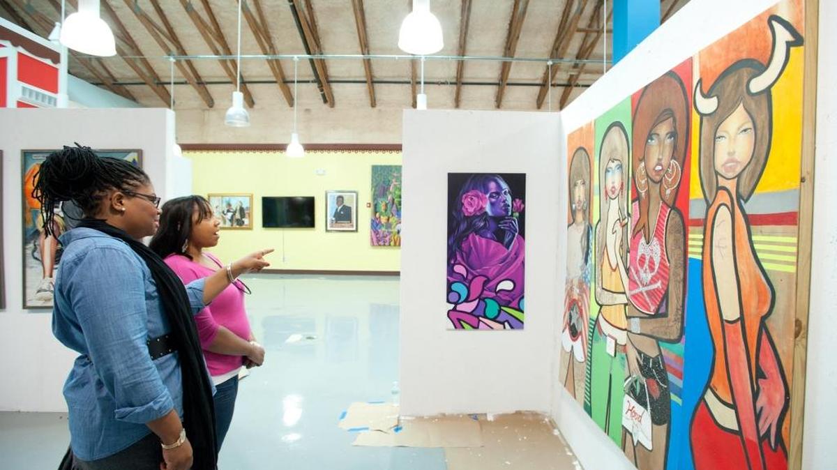 Sandy Dorsainvil, manager of the Little Haiti Cultural Center, left, and Joann Milord, director of the Northeast Second Avenue Partnership, at the Caribbean Market Place in Little Haiti.