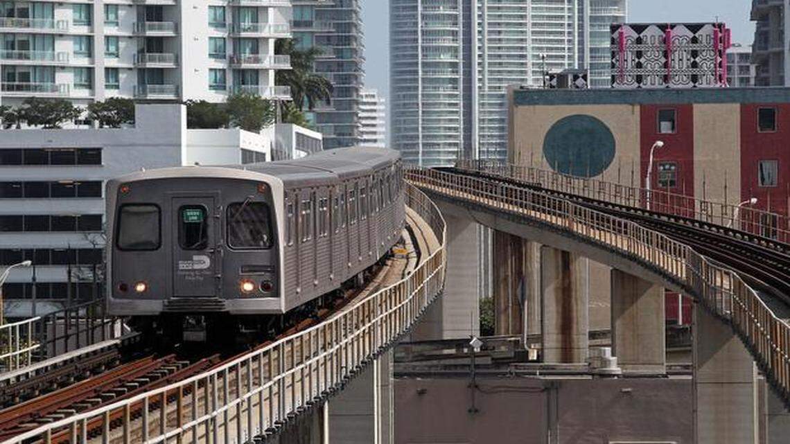 
The Green line Metrorail train arrives at Government Center Station from Dadeland Station as Brickell Avenue high rises can be seen in the background on Friday, May 9, 2014.

