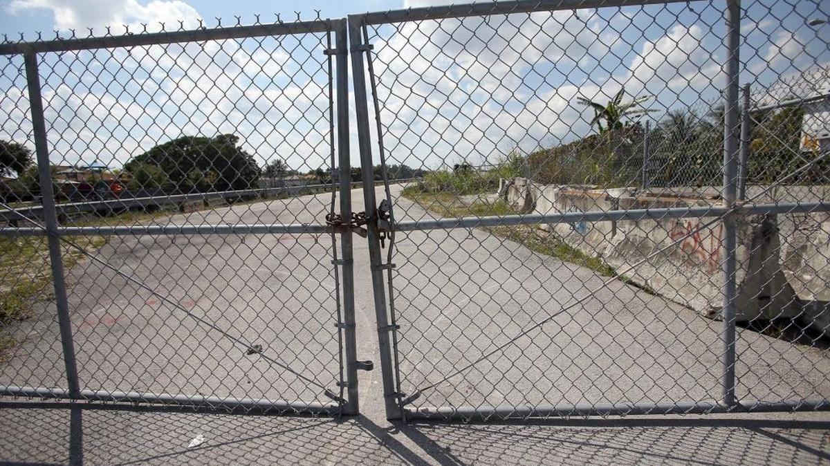 A locked gate cutting off westbound traffic on Northwest 170th Street near the proposed American Dream mega-mall site, located between Miami Lakes and Hialeah, just south of where I-75 meets the Turnpike.