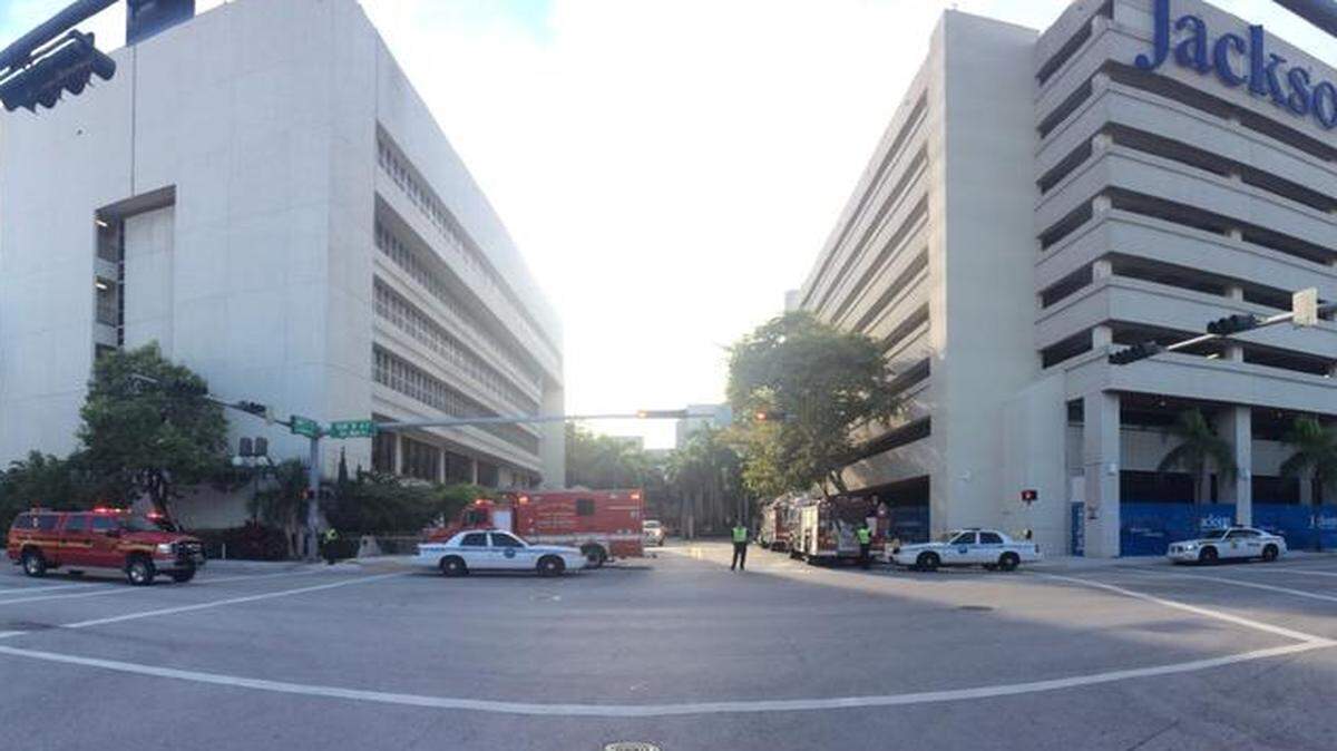 
Police and Fire Rescue can be seen outside of Jackson Memorial Hospital, Sunday, Oct. 3, 2014.
