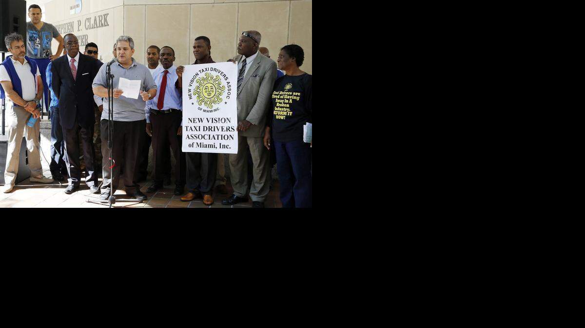 
Drivers protested Uber’s drop in prices — and local government’s failure to regulate ride-for-hire services — outside Miami-Dade County Hall last month.
