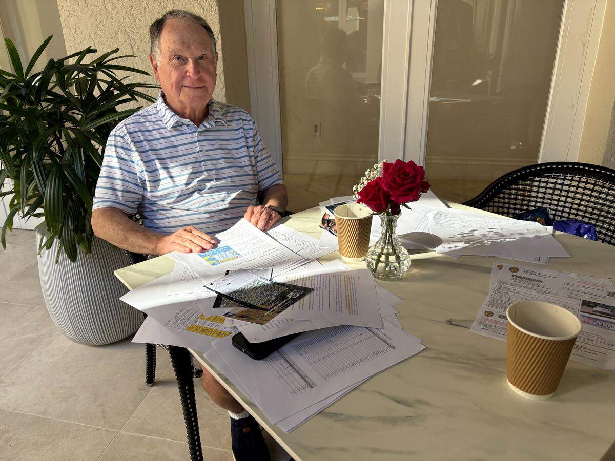 David Arnold, a lawyer, sits with the research he’s conducted after receiving a $100 violation from a speed camera posted outside a Pinecrest school. Arnold said he supports the devices, but claims the rules aren’t always fairly enforced.